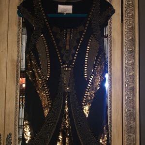 Mint sleeveless embellished gold black top